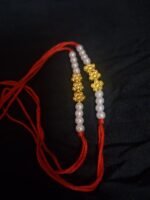 Golden Floral & Pearl Beaded Rakhi - Image 3